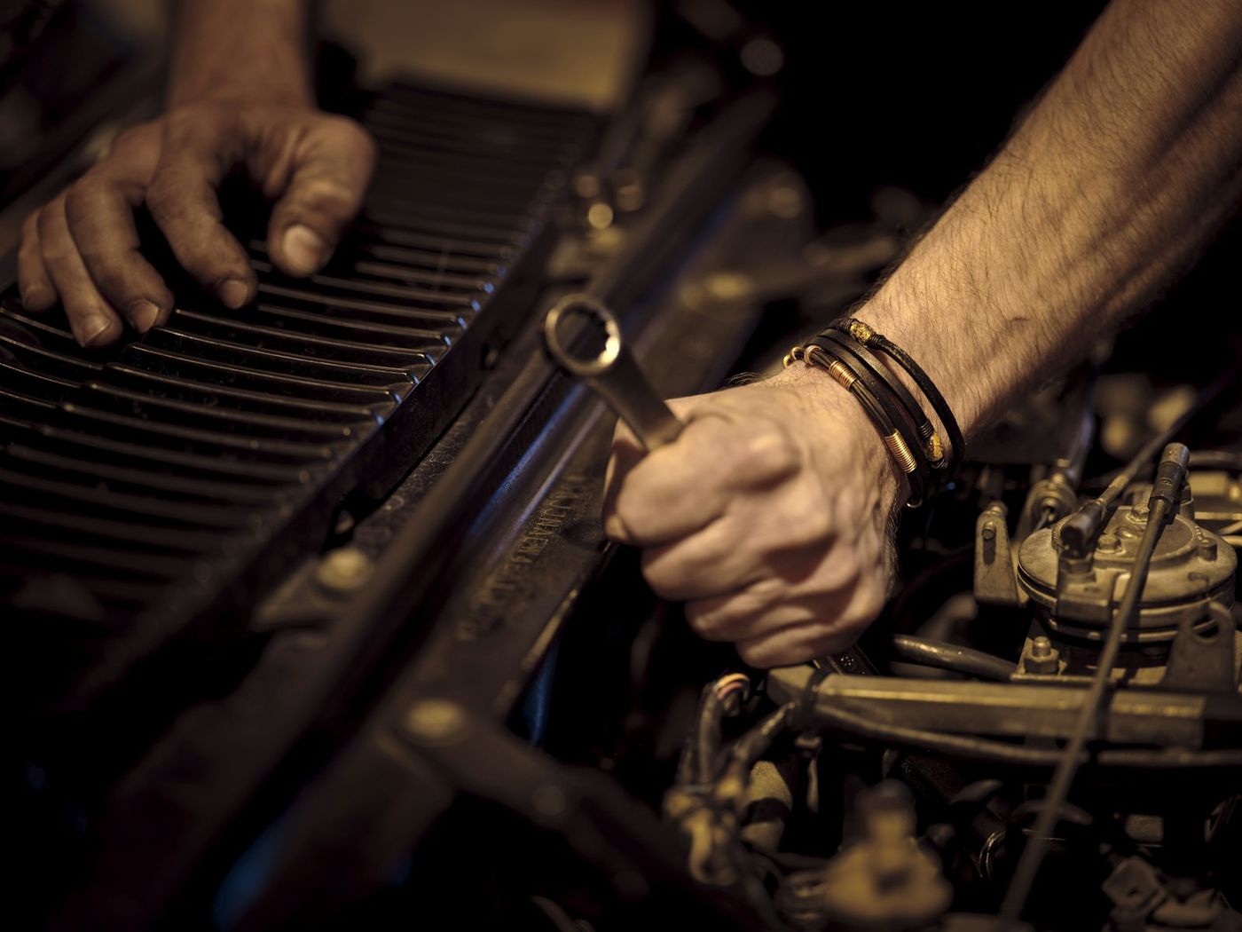Mechanic hands working with a wrench