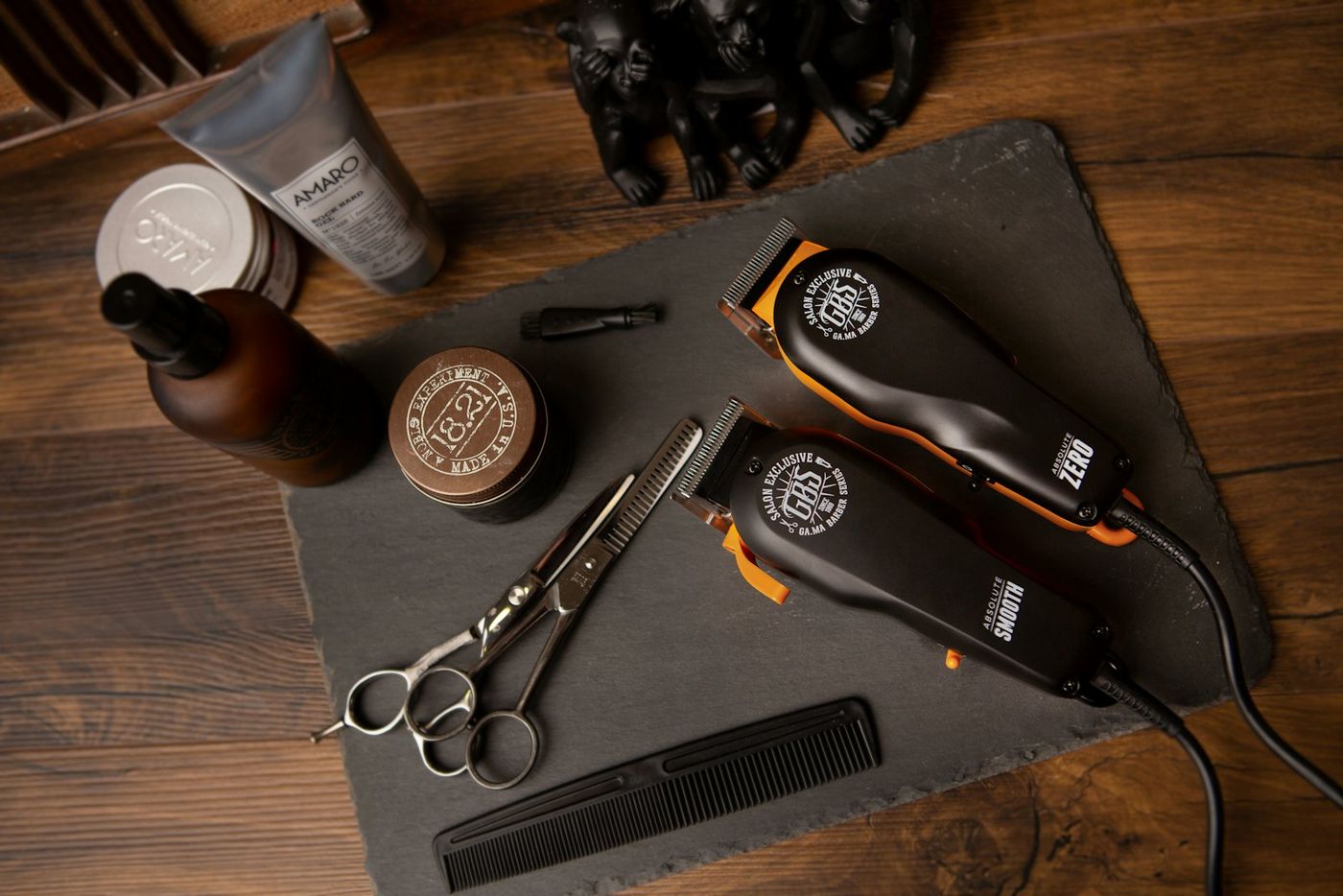 Clippers, scissors and a comb on the bench
