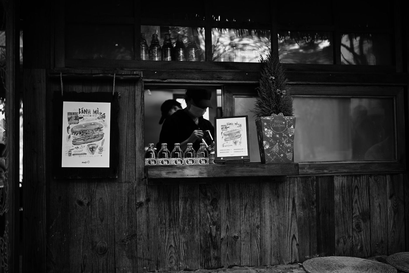 A small food stall with a serving window