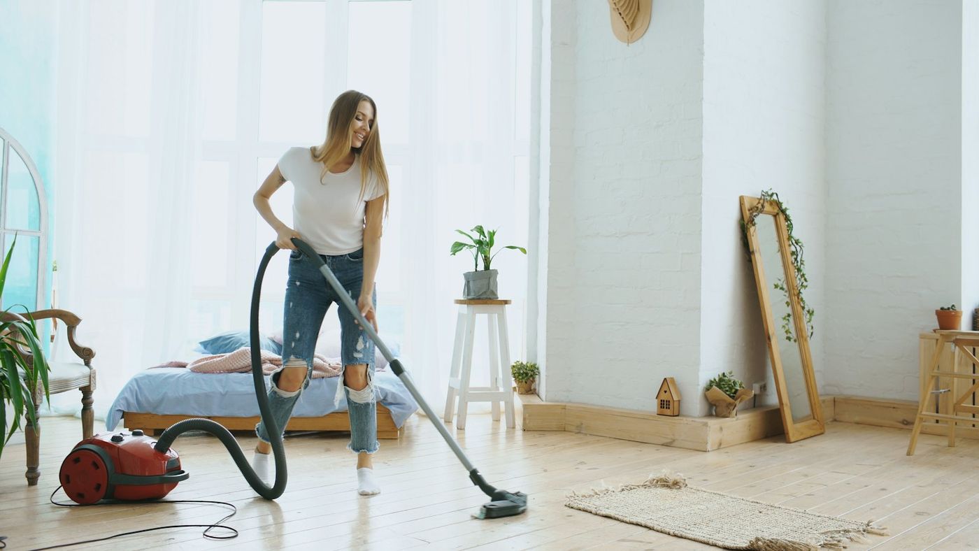 Vacuuming a bright living room