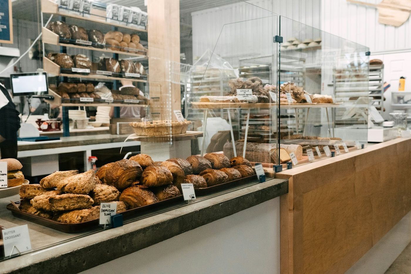 Bakery counter full of fresh bread and pastries