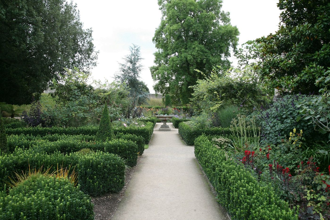 Garden with clipped hedges and flowers